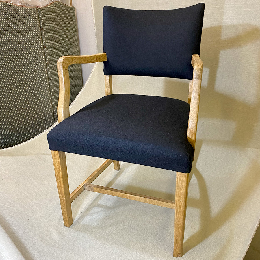 Small oak armchair rebuilt and finished in a natural black wool